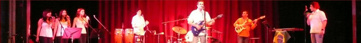Full band performing on stage